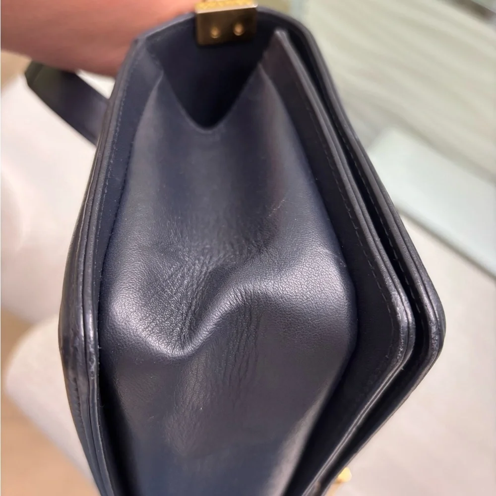 Authentic Chanel Quilted Médium Boy Flap Bag in Navy Blue